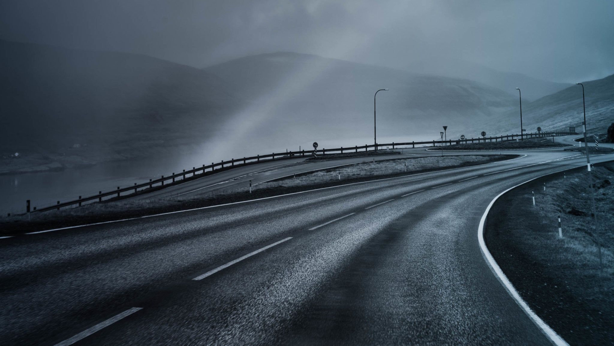 empty highway with misty hills