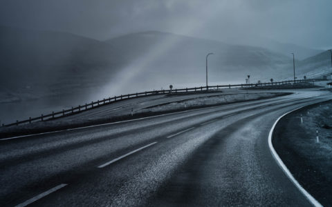 empty highway with misty hills