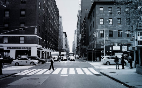 person on crosswalk on city street