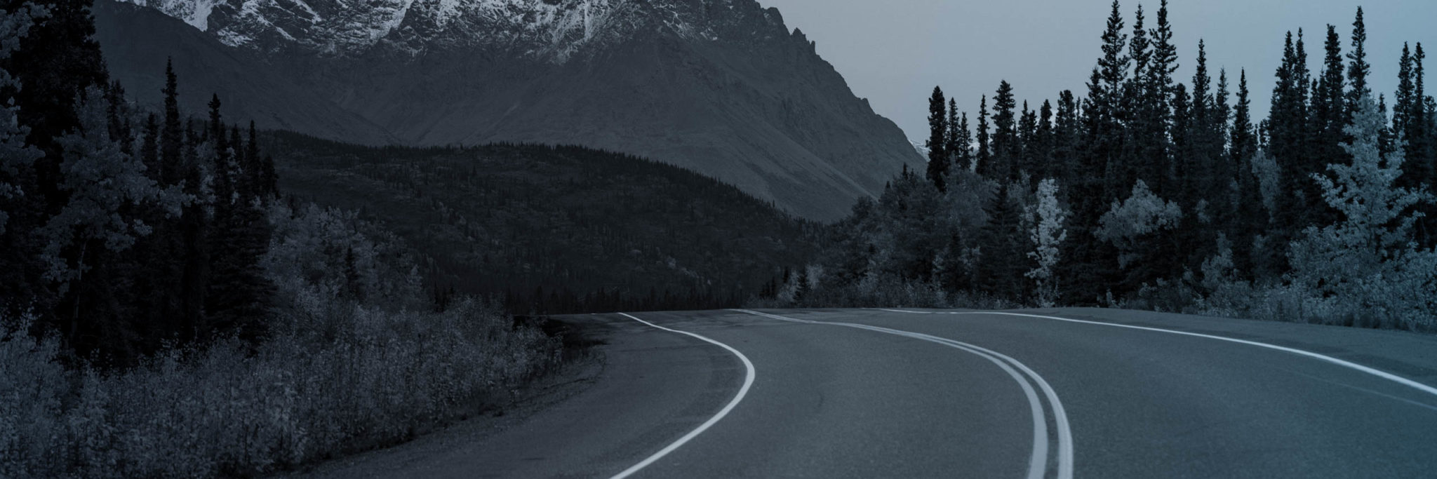 empty highway with mountain