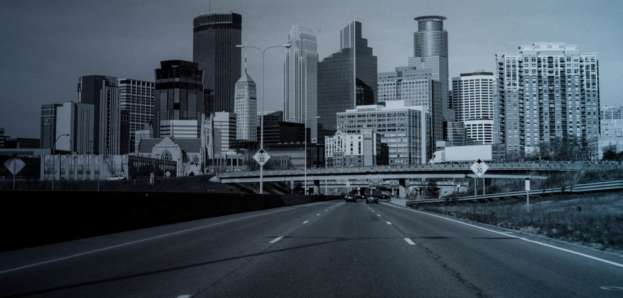 road with city in the distance